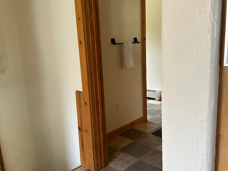Entry to the half bath and main floor laundry