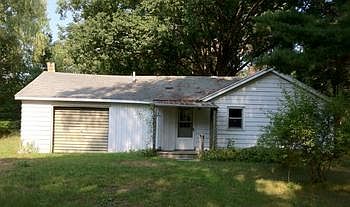 Deep lot on three acres offers privacy from the road and many mature trees.