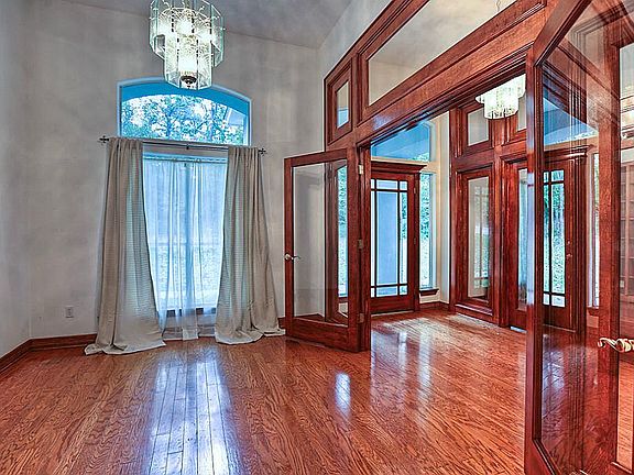 Beautiful wood work enhances entry, formal dining