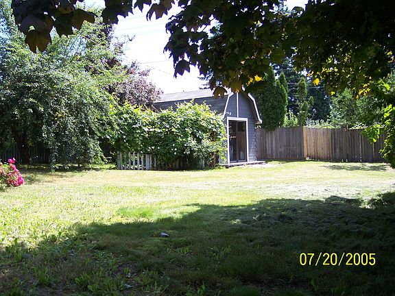 View of the yard with storage shed in the background.