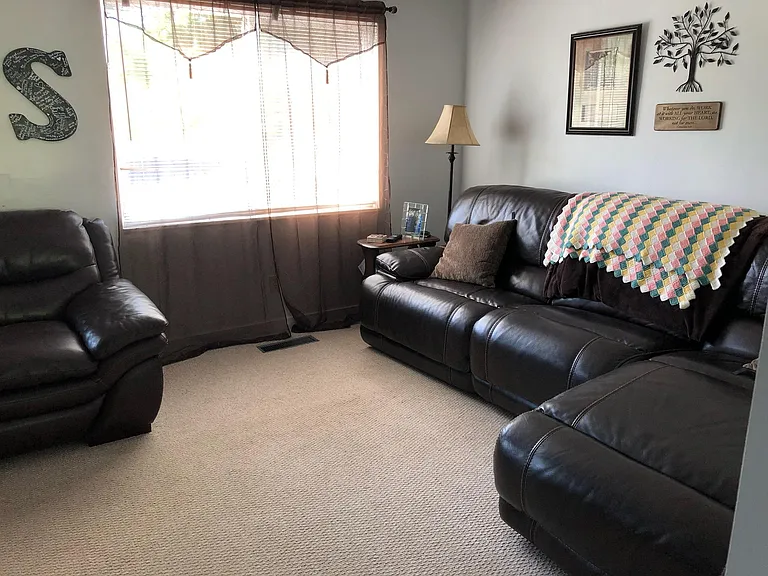 Curtains remain with house.