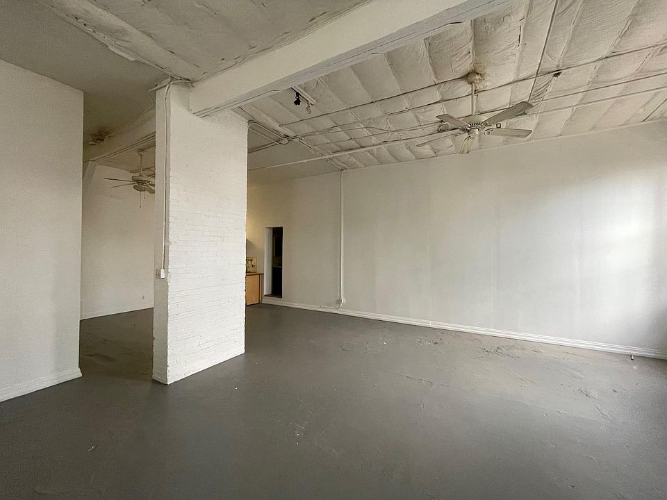 behind the brick pilaster there is a closet with a small sleeping loft above