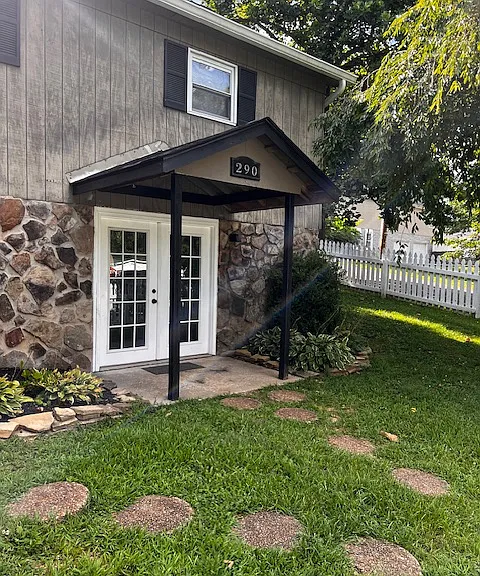 French door entrance into lower story (basement)