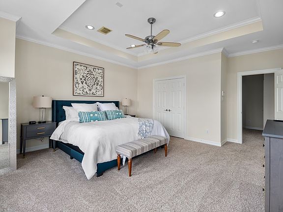 Large master bedroom with multiple closets