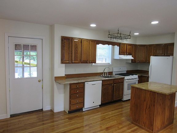 Kitchen from Eat-In Area, door to 3 season porch.