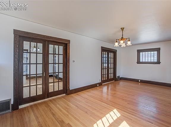 Living room looking into dining room and second bedroom