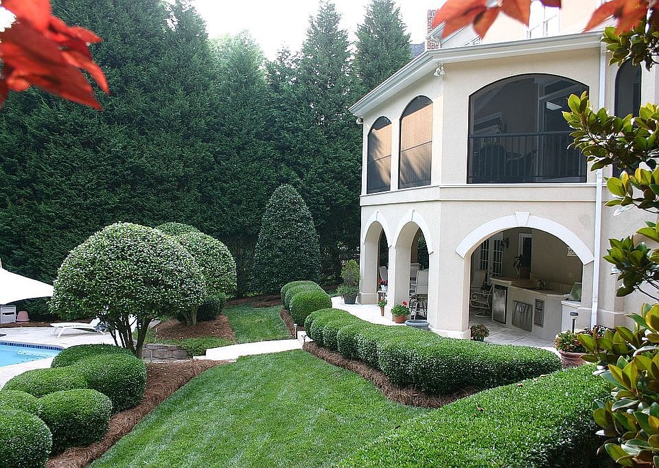 Backyard Oasis with upper level screened porch and lower covered patio/kitchen
