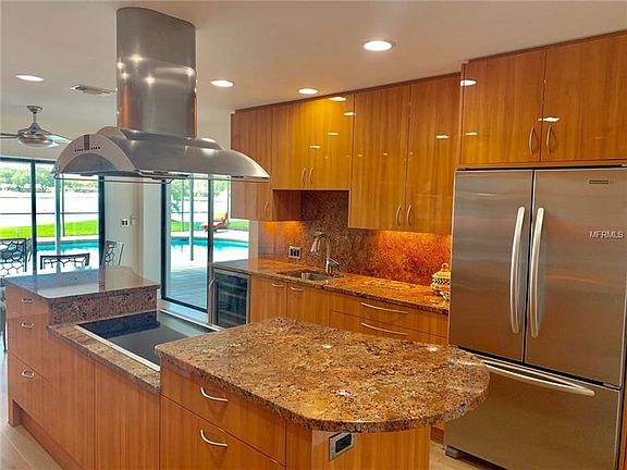 This gourmet kitchen features tons of counterspace and cabinetry for ample storage.