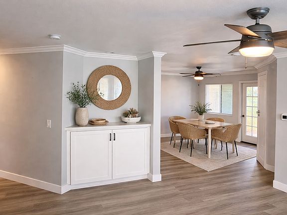 Virtually staged dining space to demonstrate layout and scale.