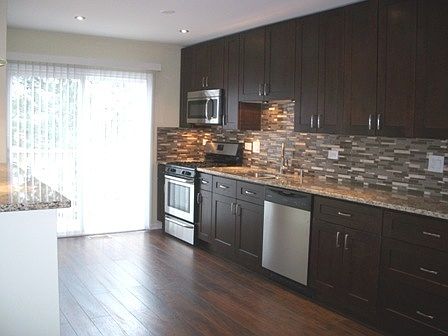 Kitchen with Granite Countertops & Stainless Steel Appliance