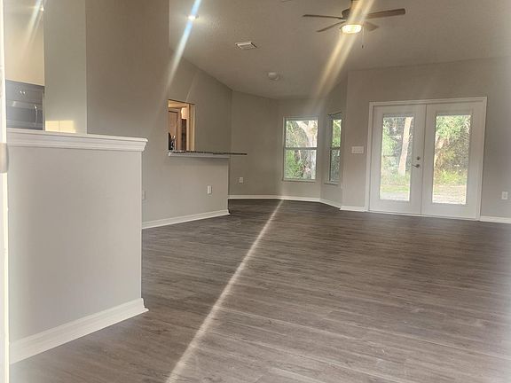 Entrance into home, extra large open- concept living room, dining room, kitchen-nook, dining room areas....