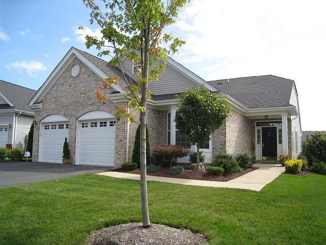 Brick front with beautiful landscaping