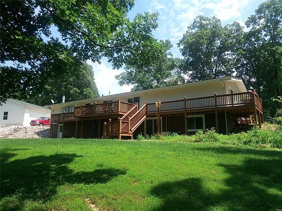 House, outbuilding and stocked pond!