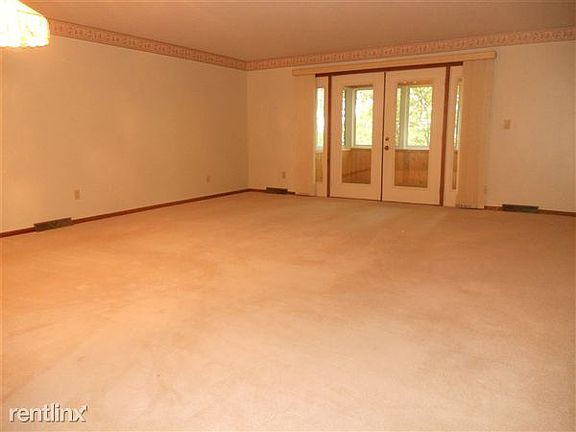 Living / dining area. Doors out to 3 season room