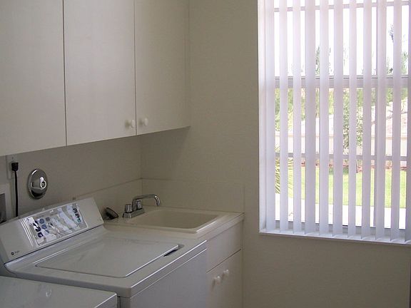 LAUNDRY ROOM WITH STORAGE.