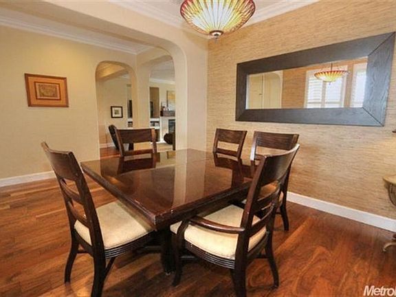 Here is the view from the dining room to the living room.  This home features gracious archways reminiscent of classic period style homes. It is sure to garner oohs and ahhhs from your friends and family when the come to see it.