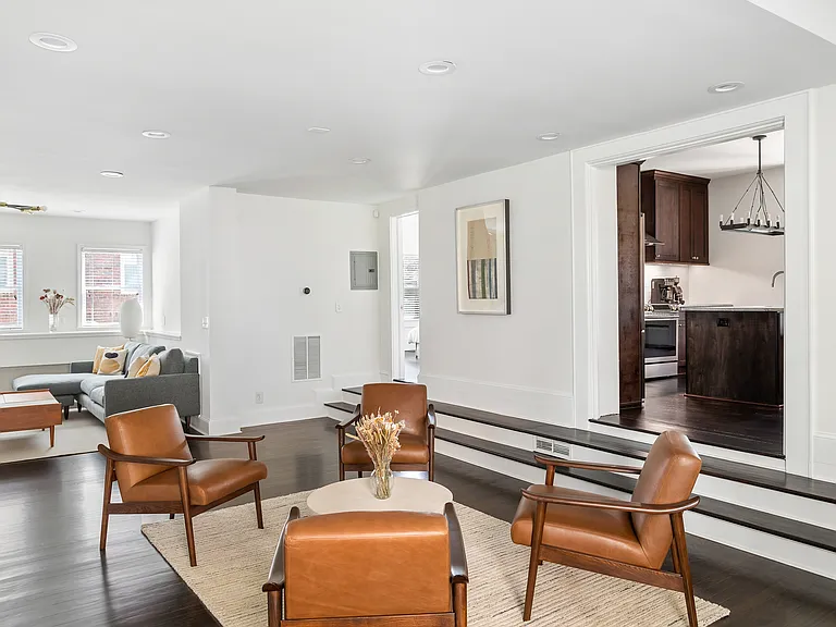 New leather chairs and plush carpet for entertaining and connecting with guests.