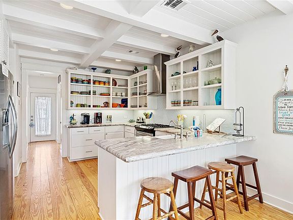 The eat-in kitchen makes meal prepping a breeze with plenty of granite counter space and additional seating at the breakfast bar.