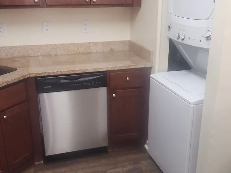 Kitchen with washer dryer unit.