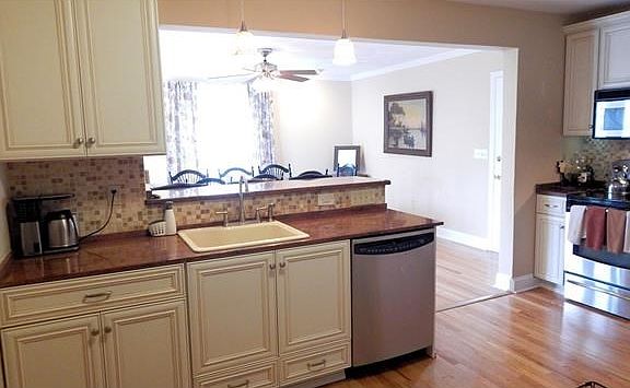 Custom Omega cabinetry, granite counter-tops breakfast bar and large dining or family room.