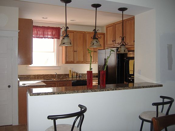 kitchen and breakfast bar view from dining room