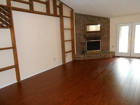 Family room is to left of entry, and easily accesses Kitchen. Recent wood flooring!
