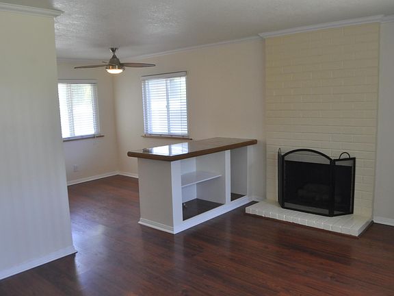 Fireplace in living room with dining area