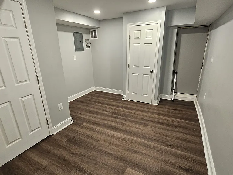 Lower Level Extra Room or Den/Office with Rear Exit to Yard and Parking Pad