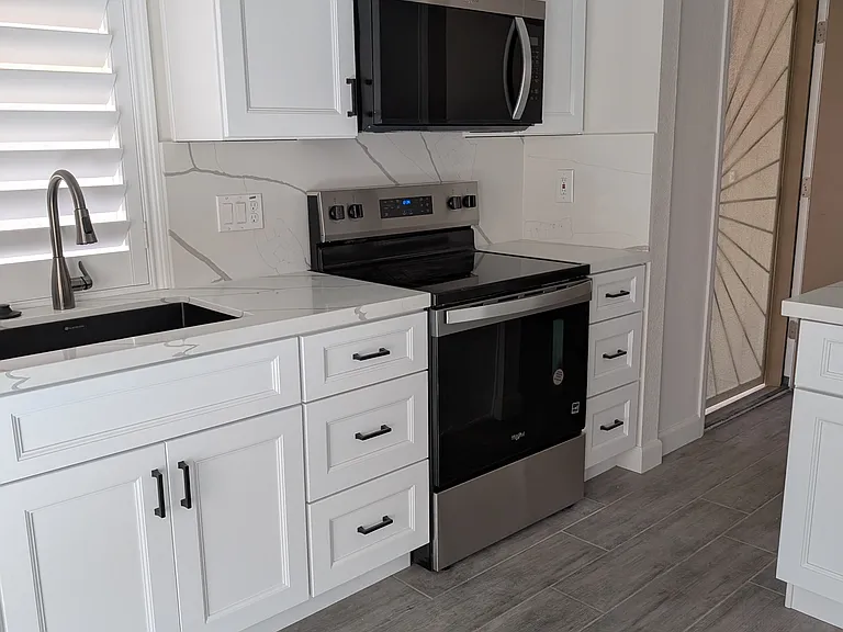 New kitchen cabinets, countertops, sink, faucette, and appliances