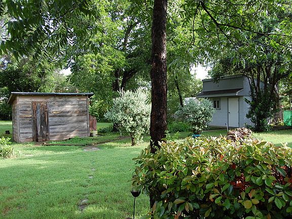 Storage Sheds
						:
						Two storage sheds and view of length of lot