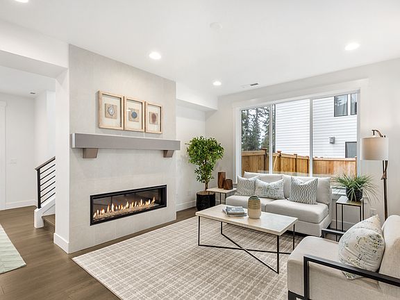 Contemporary gas fireplace with full-height tile