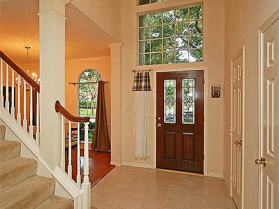 The entry is two stories with stacked windows above the front door. There are two closets in the entry.