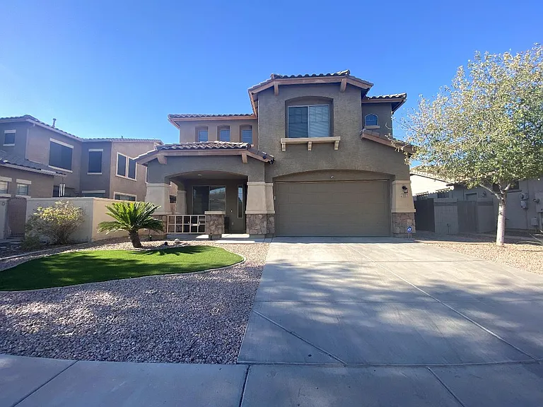 Two-story house with beautiful entrance to the house.
