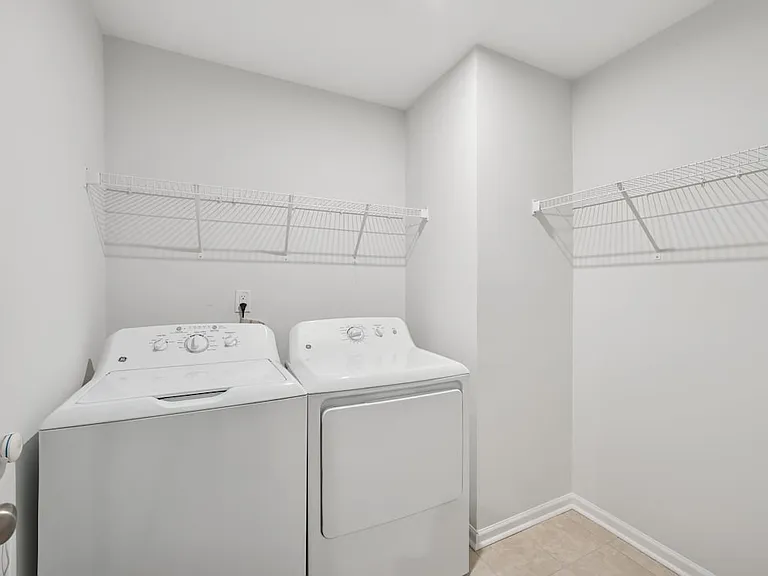 Laundry room with full-size washer and dryer