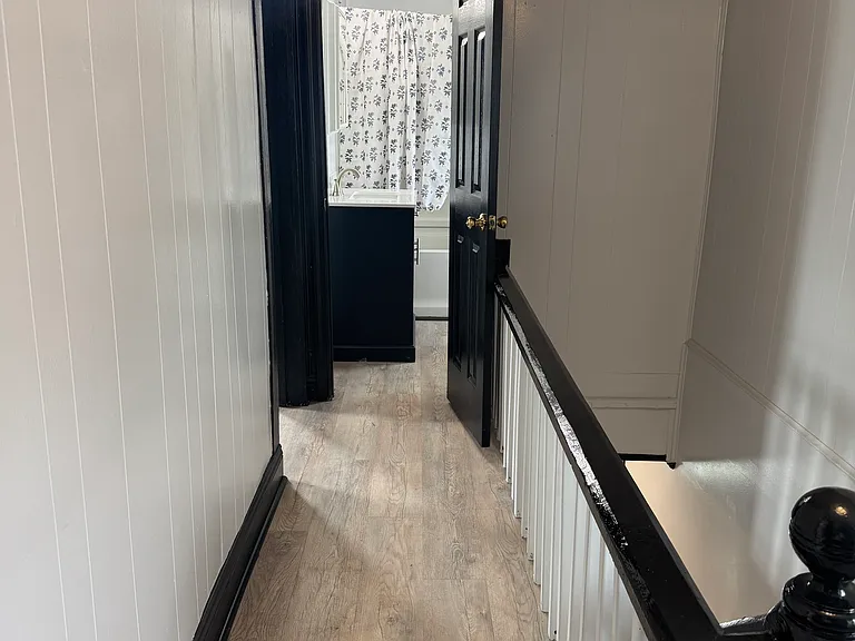 Hallway leading to 2ns floor bathroom and bedrooms 2 & 3