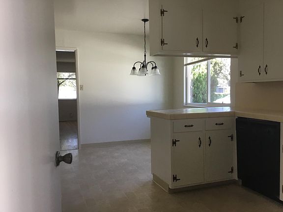Kitchen showing door to garage