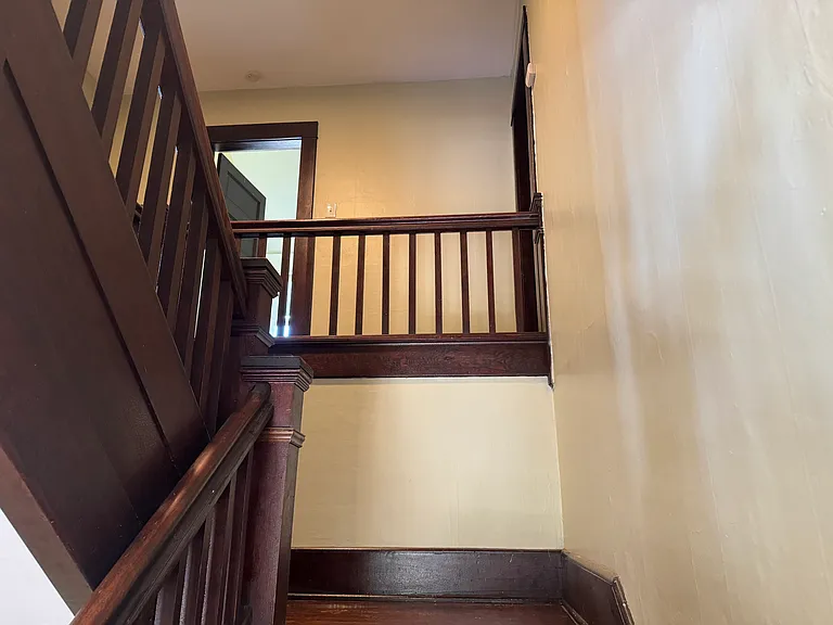 View up the grand staircase to the 2nd floor landing