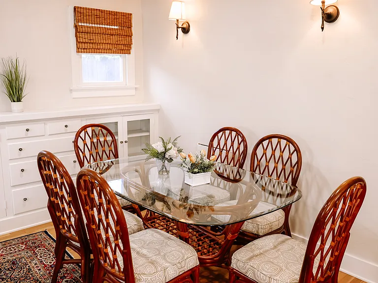 Dining room aria has built-ins below windows.