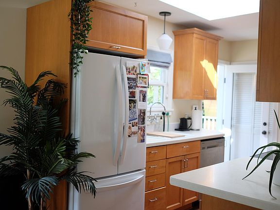 Kitchen has a dishwasher and a french door refrigerator