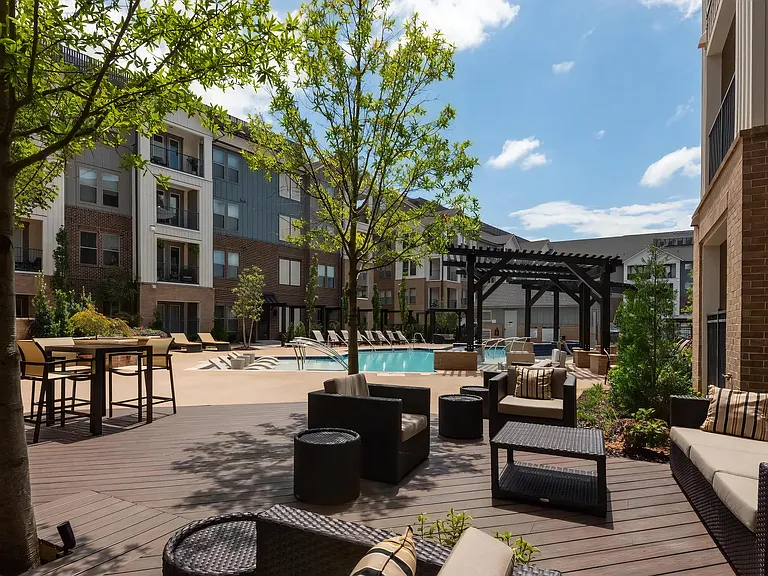 Shaded Seating Area with Comfortable Furniture Near Pool Deck