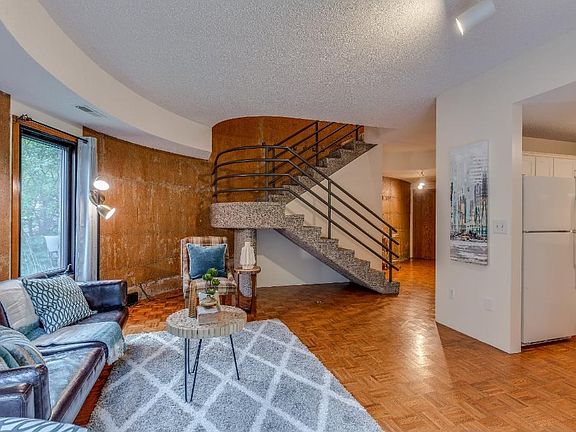 Open floor plan and staircase to the upper level.