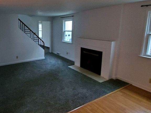 Entry with decorative fireplace