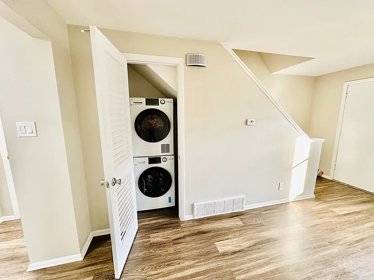 Experience convenience with this efficient laundry space, perfectly integrated into a modern home. Experience convenience with this efficient laundry space, perfectly integrated into a modern home.