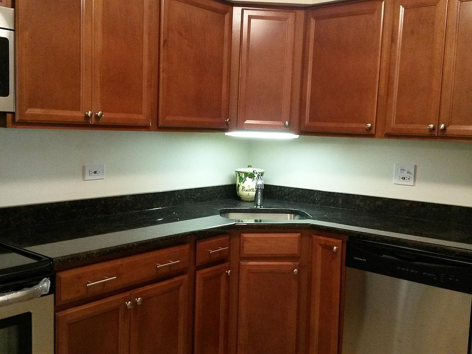 Kitchen with granite countertops and stainless steel appliances.