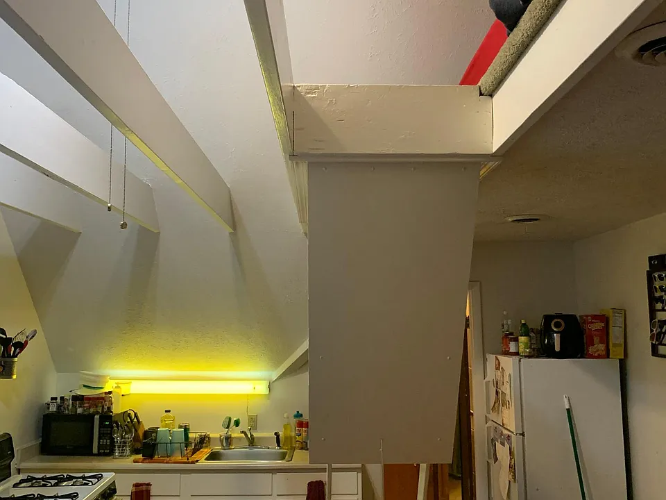 Stairs down to loft area, kitchen area
