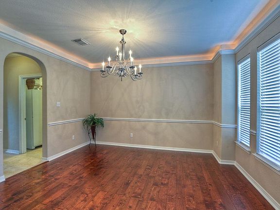 Formal Dining with Windows for Natural Light and Easy Access to the Kitchen.