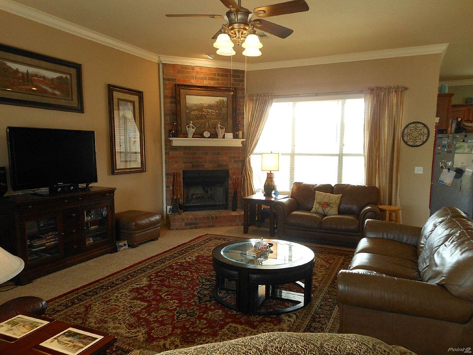 Living room with wood burning fireplace