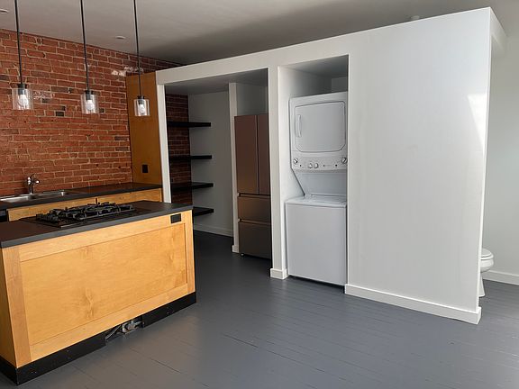 Kitchen, half bath & in-unit Laundry