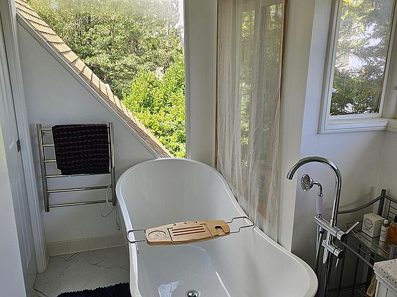 Upstairs bathroom view 1. Very Large soaking tub. Views of Mt. Baldy with amazing sunset views and lots of privacy.