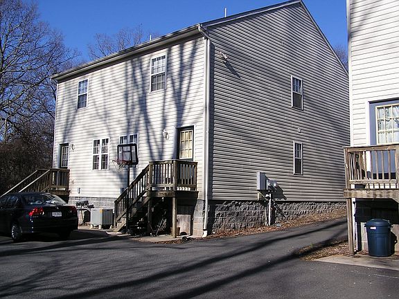 View of rear shows paved parking